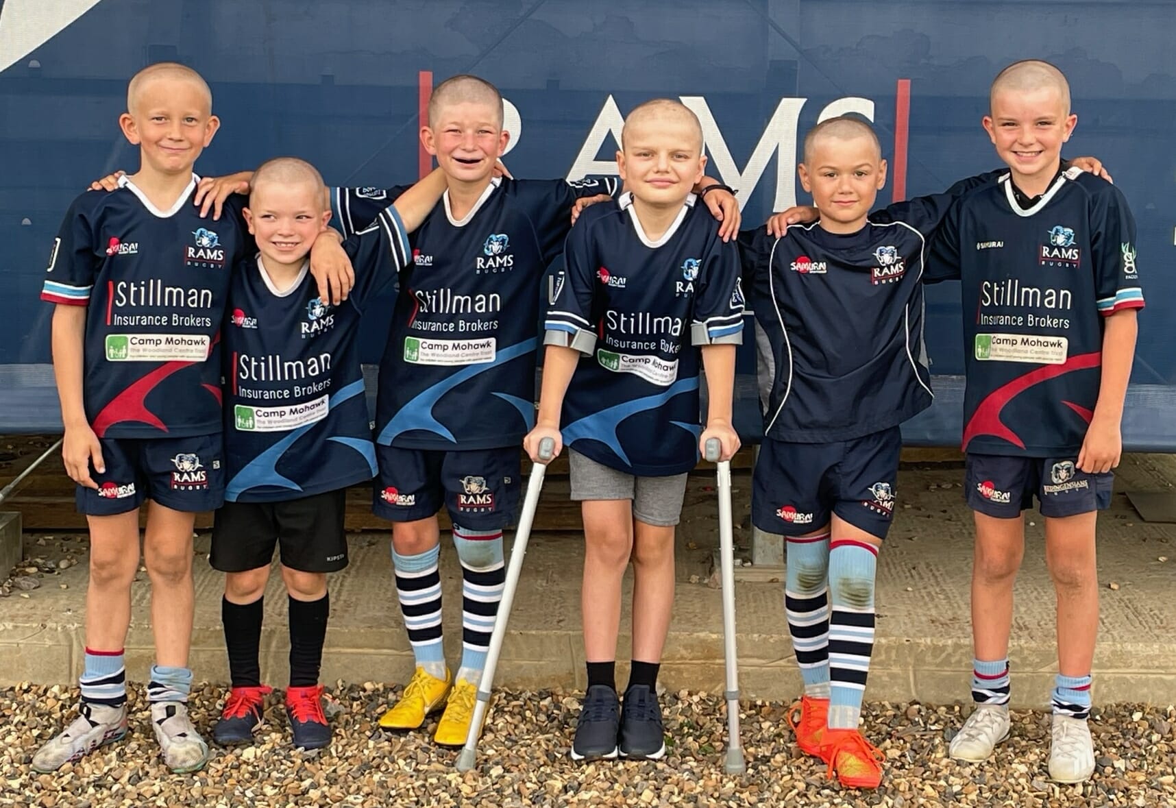 Rams RFC under-9s with Harry after the head shave for charity.